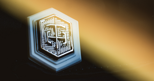 Close-up of THEODORE signature badge , highlighting craftsmanship, detail, and Smart Luxury menswear.